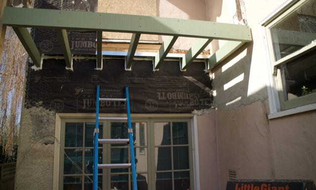 new cantilevered floor framing at balcony